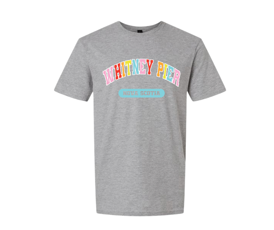A heather grey short-sleeve t-shirt with a colourful graphic on the chest reading 'WHITNEY PIER' in pastel rainbow letters and a light blue banner below reading 'NOVA SCOTIA'.